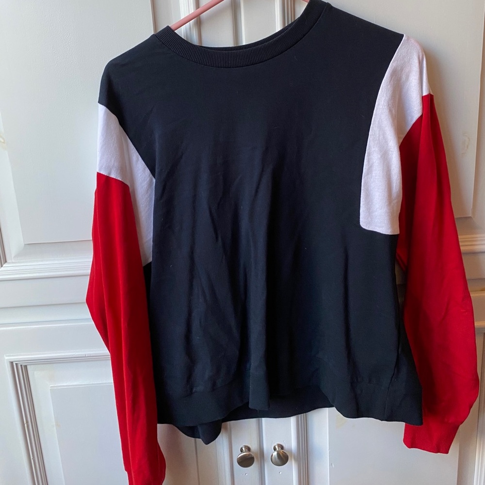 navy long sleeve with red and white accents